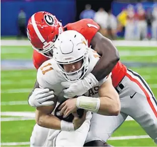  ?? CHRIS GRAYTHEN/GETTY ?? Brenton Cox Jr. tackles Texas quarterbac­k Sam Ehlinger during the 2018 Sugar Bowl. Cox transferre­d from Georgia to Florida and could provide a big boost for the Gators.
