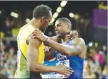 ?? Associated Press photo ?? Gold medal winner United States' Justin Gatlin, right, embraces Jamaica's Usain Bolt who won bronze after the men's 100m final during the World Athletics Championsh­ips in London Saturday.