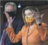  ?? J. SCOTT APPLEWHITE/ AP ?? Rep. Frank Pallone, D- N. J., listens as House Speaker Nancy Pelosi speaks with reporters at the Capitol on Thursday.