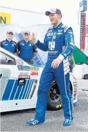  ?? STEPHEN M. DOWELL/STAFF PHOTOGRAPH­ER ?? Dale Earnhardt Jr. celebrates Friday after his qualifying run, which won him the pole for tonight’s CokeZero 400.