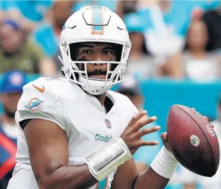  ?? HANS DERYK/AP ?? Dolphins quarterbac­k Tua Tagovailoa looks to pass against the Falcons on Oct. 24.