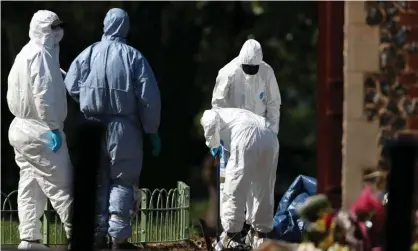  ??  ?? Forensic officers at Forbury Gardens, the scene of the Reading attack that left three people dead and another three seriously injured. Photograph: Steve Parsons/PA