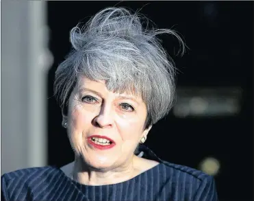  ?? REUTERS ?? Britain’s Prime Minister Theresa May made the announceme­nt yesterday. Traders said it could lead to strengthen the sterling.PHOTO: