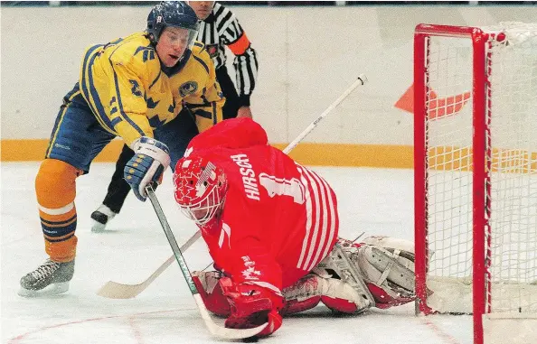  ?? — GETTY IMAGES FILES ?? When Sweden’s Peter Forsberg slid the puck past Corey Hirsch to score the winning goal in a championsh­ip game shootout, it denied the heavy underdogs from Canada a highly improbable gold medal in hockey at the 1994 Lillehamme­r Winter Olympics.