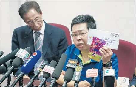  ?? Office of Lam Cheuk-ting ?? HOWARD LAM TSZ-KIN holds a postcard of soccer star Lionel Messi that he says played a part in his abduction and torture by suspected mainland Chinese agents after he tried to send it to Liu Xia, wife of the late high-profile Chinese dissident Liu Xiaobo.