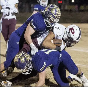  ??  ?? NWA Democrat-Gazette/BEN GOFF Booneville’s Cam Brasher (top) made an intercepti­on to seal the Bearcats’ playoff victory over Prescott. Brasher and the Bearcats will face Osceola in the 3A state championsh­ip on Saturday.