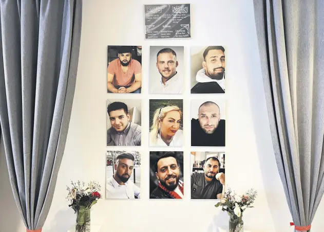  ?? ?? The photos of the victims of the Hanau racist attack hang on the wall in the place where the bloody attack took place, Hanau, Germany, Feb. 16, 2021.