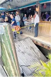  ?? COURTESY ?? A 15-by-15-foot portion of the waterside dock at Flip
Flops Dockside Eatery in Fort Lauderdale collapsed Friday evening, causing at least three customers to be pulled out of the water by a nearby boat, according to Fort Lauderdale Fire Rescue Battalion Chief Stephen Gollan.