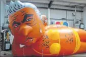  ?? AP ?? A blimp of London Mayor Sadiq Khan “rests” at a workshop in Oxfordshir­e.