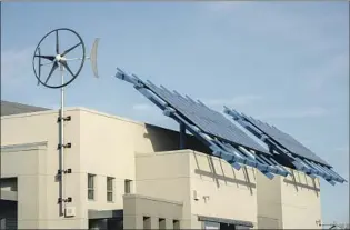  ?? Tomas Ovalle For The Times ?? SOLAR PANELS installed on the roof of Buchanan High School in Clovis, Calif.