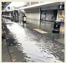 ??  ?? SWAMPED Flooding in the Bury shopping centre yesterday