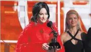  ?? Matt Sayles The Associated Press ?? Kacey Musgraves accepts the award for best country album for “Golden Hour” at the 61st annual Grammy Awards on Sunday in Los Angeles.