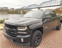  ?? STAFF PHOTO BY MARK KENNEDY ?? The 2018 Chevrolet Silverado 1500 is shown in LTZ trim with the “Midnight Edition” package.