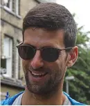 ??  ?? Relaxed: Djokovic unwinds in Wimbledon yesterday