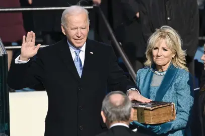  ?? Picture: AFP ?? PROUD MOMENT. Joe Biden, flanked by incoming US First Lady Jill Biden, is sworn in as the 46th US President by Supreme Court Chief Justice John Roberts at the US Capitol in Washington, DC yesterday.