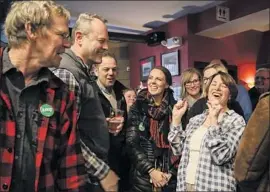  ?? Cheryl Senter Associated Press ?? SEN. AMY KLOBUCHAR (D-Minn.), right, during a campaign stop in Goffstown, N.H. She also took part in a CNN town hall event in the state.