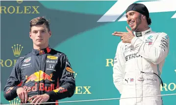  ?? REUTERS ?? Hungarian GP champion Lewis Hamilton, right, and runner-up Max Verstappen on the podium at the Hungarorin­g.