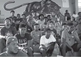  ?? STAFF PHOTO BY DOUG STRICKLAND ?? Attendees listen to Brainerd graduates speak during a sportsmans­hip clinic at Brainerd High School on Saturday. Brainerd basketball coach Levar Brown hosted the clinic in the wake of a brawl between Brainerd and Austin East during a February basketball...