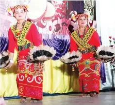  ??  ?? The ladies perform the hornbill dance.