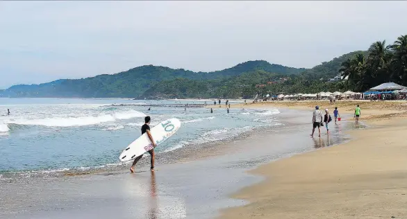  ?? PHOTOS: ELAINE O’CONNOR ?? Sayulita, Mexico, is a bright, neo-hippy town rife with surfers, backpacker­s, and artists located on the Riviera Nayarit coast, far from the all-inclusive resorts.