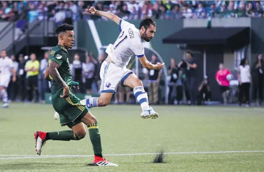  ?? BEN LUDEMAN/THE OREGONIAN VIA THE ASSOCIATED PRESS ?? The Impact’s Matteo Mancosu fires a shot against the Portland Timbers Saturday in Portland, Ore.