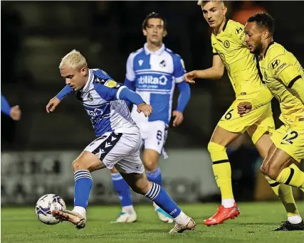  ?? Will Cooper/JMP ?? Bristol Rovers’ Luke Thomas evades the attentions of two Chelsea U21 players during Wednesday night’s Papa John’s Trophy match at the Memorial Stadium. His eyecatchin­g performanc­e means that he is now likely to be in contention for a place in Joey Barton’s side to face Bradford City in League Two tommorrow