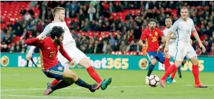  ??  ?? Substitute Isco struck deep in stoppage time to earn Spain a 2-2 draw against england. —