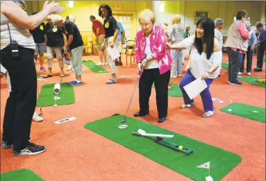  ?? Hearst Connecticu­t Media file photo ?? Watermark at 3030 Park residents participat­e in a charity minigolf event at in 2017. The Bridgeport community has among the lowest assistedli­ving room rates in the region.