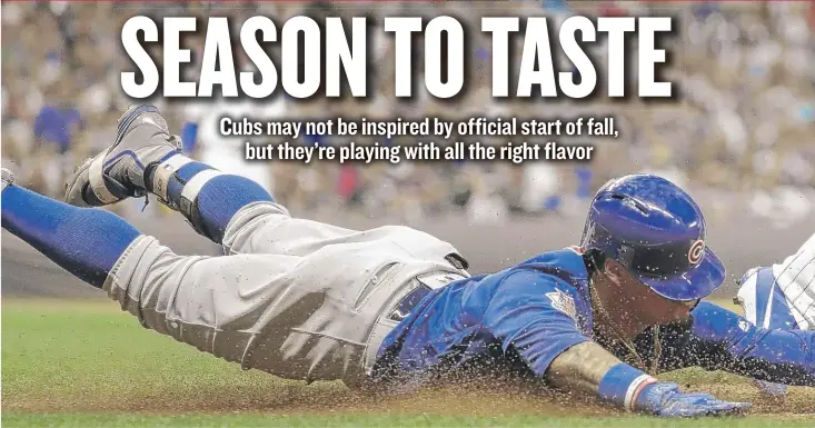  ?? | MORRY GASH/ AP ?? Javy Baez beats the Brewers’ Corey Knebel to first base for a single in the ninth inning Friday night in Milwaukee. The Cubs won 5- 4 in 10 innings to knock the Brewers into third place in the NL Central.