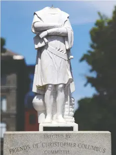  ?? — GETTY IMAGES ?? A Christophe­r Columbus statue was beheaded overnight at Christophe­r Columbus Waterfront Park on Wednesday in Boston.