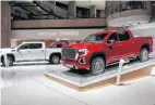  ?? AP PHOTO ?? This file photo shows a GMC Sierra pickup, left, and Denali in Detroit last month. General Motors’ posted an $8.1 billion net profit last year as it got better prices for vehicles sold in the U.S., its most lucrative market.
