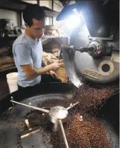  ?? Mark Costantini / The Chronicle 2009 ?? Jeremy Tooker, shown roasting beans at Four Barrel Coffee in S.F. in 2009, has been accused of sexual assault and harassment by female former employees ina lawsuit.