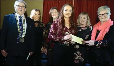  ??  ?? Sarah Dennehy receiving her third place prize from Margaret Burke in the presence of Noel Buckley, chairman, Millstreet Community Council, Pat Barry. Maura Kiely and Mary Collins.