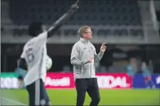  ?? SUBMITTED PHOTO — COURTESY OF PHILADELPH­IA UNION ?? Union coach Jim Curtin communicat­es with his players as defender Olivier Mbaizo prepares to take a throw-in during Wednesday’s game against D.C. United.