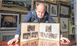  ?? Picture: Steve MacDougall. ?? Top, from left: Brooklyn Bridge, New York; Maori god Tiki, Ohinemutu, New Zealand; and Wall Street in New York. Above: auctioneer Nick Burns with the album of images from a trip around the world in the 1880s.