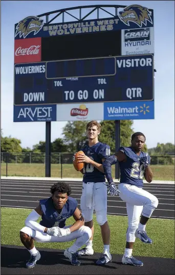  ??  ?? Jadon Jackson (from left), Will Jarrett and Tyrese Smallwood pose for a portrait July 23 at Bentonvill­e West High School in Centerton.