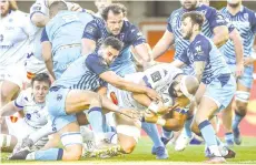  ??  ?? Castres’ Tongan flanker Maama Valipulu (centre) scores a try during the French TOP 14 rugby union match between Montpellie­r MHR and Castres. - AFP photo