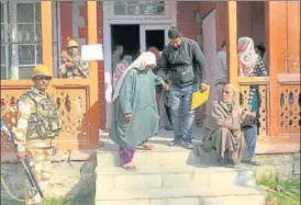  ?? WASEEM ANDRABI/HT PHOTO ?? A woman comes out of a polling station after casting her vote for the third phase of municipal elections in Srinagar on Saturday.