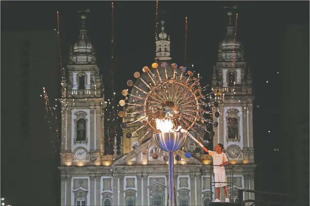  ?? (File Photo/AP/Natacha Pisarenko) ?? Jorge Alberto Oliveira Gomes lights the Olympic cauldron during the opening ceremony of the 2016 Summer Olympics in Rio de Janeiro, Brazil.