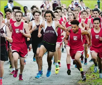  ?? SEAN D. ELLIO/THE DAY ?? East Lyme’s Sam Whittaker, center, jostles for space between two NFA runners in the starting pack during Tuesday’s ECC Division I cross country showdown at Mohegan Park. Whittaker won the race as the Vikings ended NFA’s dual-meet winning streak at 60...