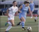  ?? JOHN BLAINE — FOR THE TRENTONIAN ?? Notre Dame’s Olivia Panko, right, moves the ball while being chased by Hightstown’s Jamie Seip, left, during Wednesday afternoon’s game.