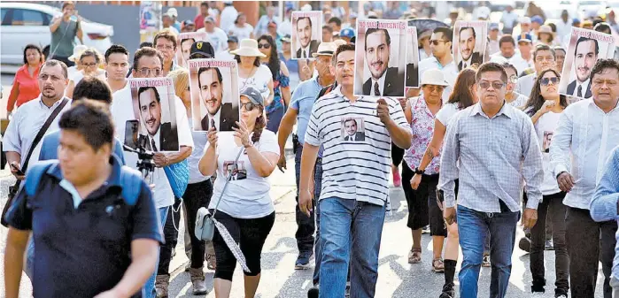  ?? PEDRO DOMÍNGUEZ ?? Parte del contingent­e que marchó ayer en el municipio para pedir mayores logros contra el crimen de manera inmediata.