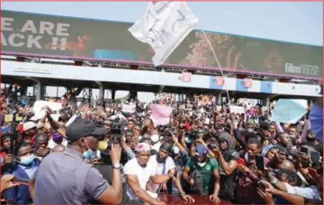  ??  ?? Protesters being addressed by the Lagos State Governor, Babajide Sanwo-Olu