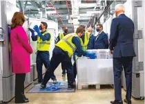  ?? DOUG MILLS/NEW YORK TIMES FILE PHOTO ?? President Joe Biden tours Pfizer’s manufactur­ing plant in Kalamazoo, Mich., last month. Pressure is growing for the United States to share its vaccine stock.