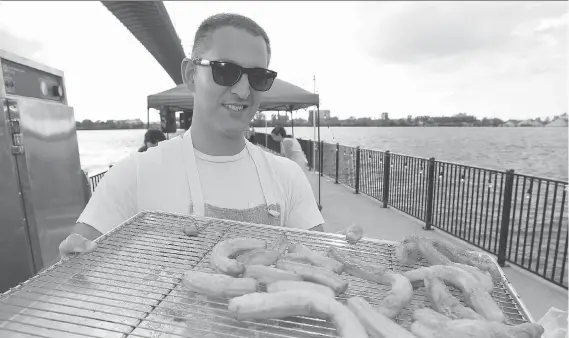  ?? NICK BRANCACCIO ?? Chef Johnny Oran displays fresh churros during WindsorEat­s’ Dinner on a Pier, a $135 per person event near the base of the bridge at Ambassador Park.