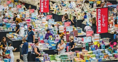  ?? Photos by Neeraj Murali ?? Visitors shopping at the Big Bad wolf Book Sale in Dubai Studio City on Thursday. —