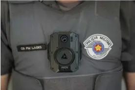  ?? Photograph: André Penner/AP ?? A police officer wearing a bulletproo­f vest installed with a body cam in São Paulo, Brazil.