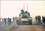  ?? AFP ?? Turkish troops advance near the Syria border at Hassa.