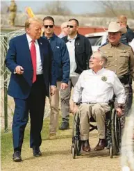  ?? ERIC GAY/AP ?? Republican presidenti­al candidate former President Donald Trump talks with Texas Gov. Greg Abbott during a visit to the U.S.-Mexico border Thursday in Eagle Pass, Texas.