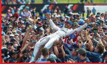  ??  ?? Above: Hamilton crowd surfs over his legion of home fans at Silverston­e. Left: The race started in typical British weather. Below: Räikkönen couldn't find a way past Verstappen and finished 6th